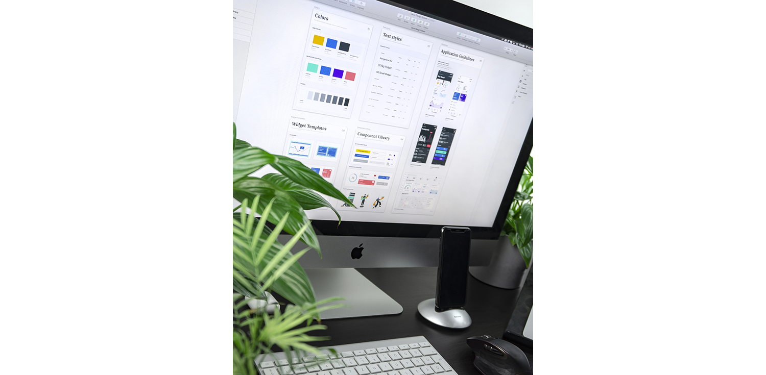 An iMac displaying a design system on the screen